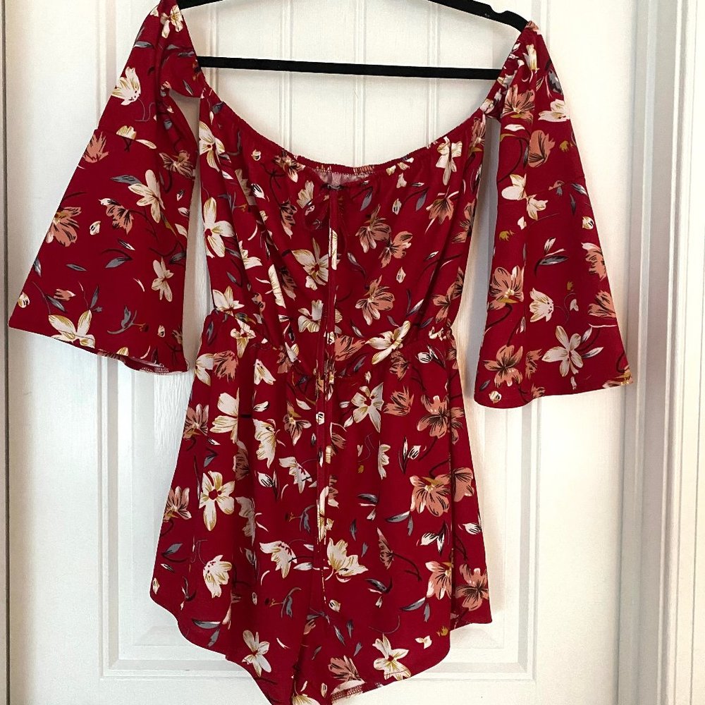 Off the shoulder romper with flower detail and open sleeves